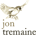 Jon Tremaine logo, with flying bird
