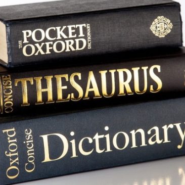 pile of dictionaires and a thesaurus